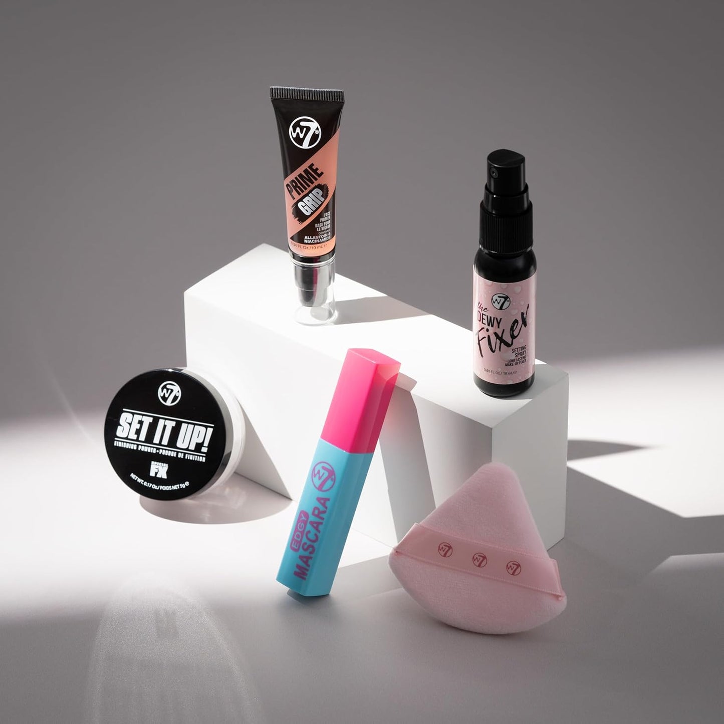 W7 On the Go Cuties Gift Set - Mini Makeup Essentials with Primer, Mascara, Setting Spray, Loose Powder & Powder Puff - Travel Size Beauty Favourites - Stocking Stuffer
