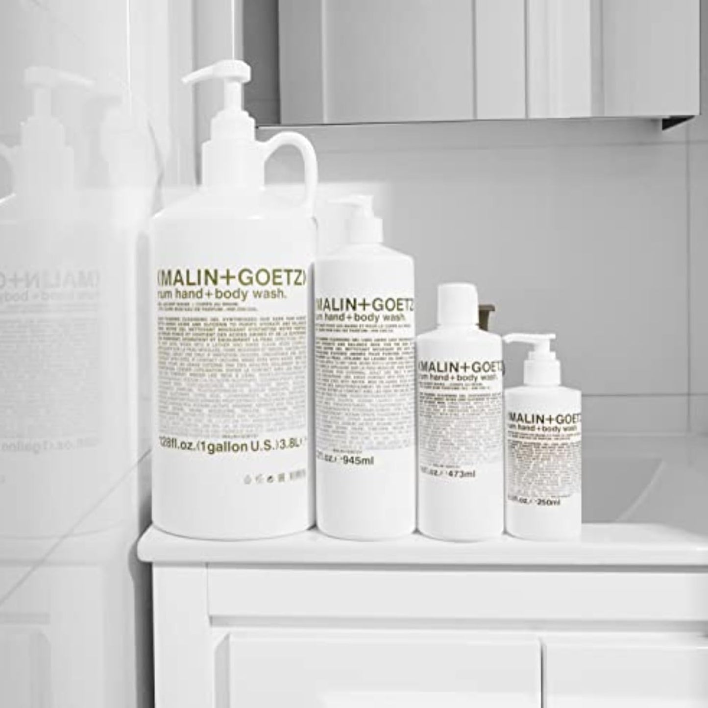 MALIN+GOETZ Hand + Body Wash | Gentle Foaming Cleanser with Botanical Extracts and Amino Acids | Hydrating, pH-Balanced, Unisex Scent | Vegan & Cruelty-Free (Rum, 128 Fl Oz)