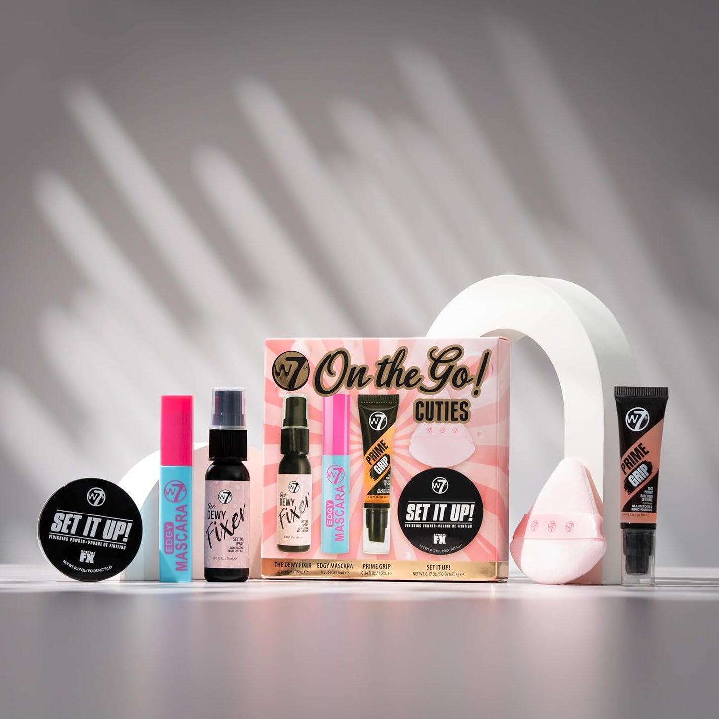 W7 On the Go Cuties Gift Set - Mini Makeup Essentials with Primer, Mascara, Setting Spray, Loose Powder & Powder Puff - Travel Size Beauty Favourites - Stocking Stuffer