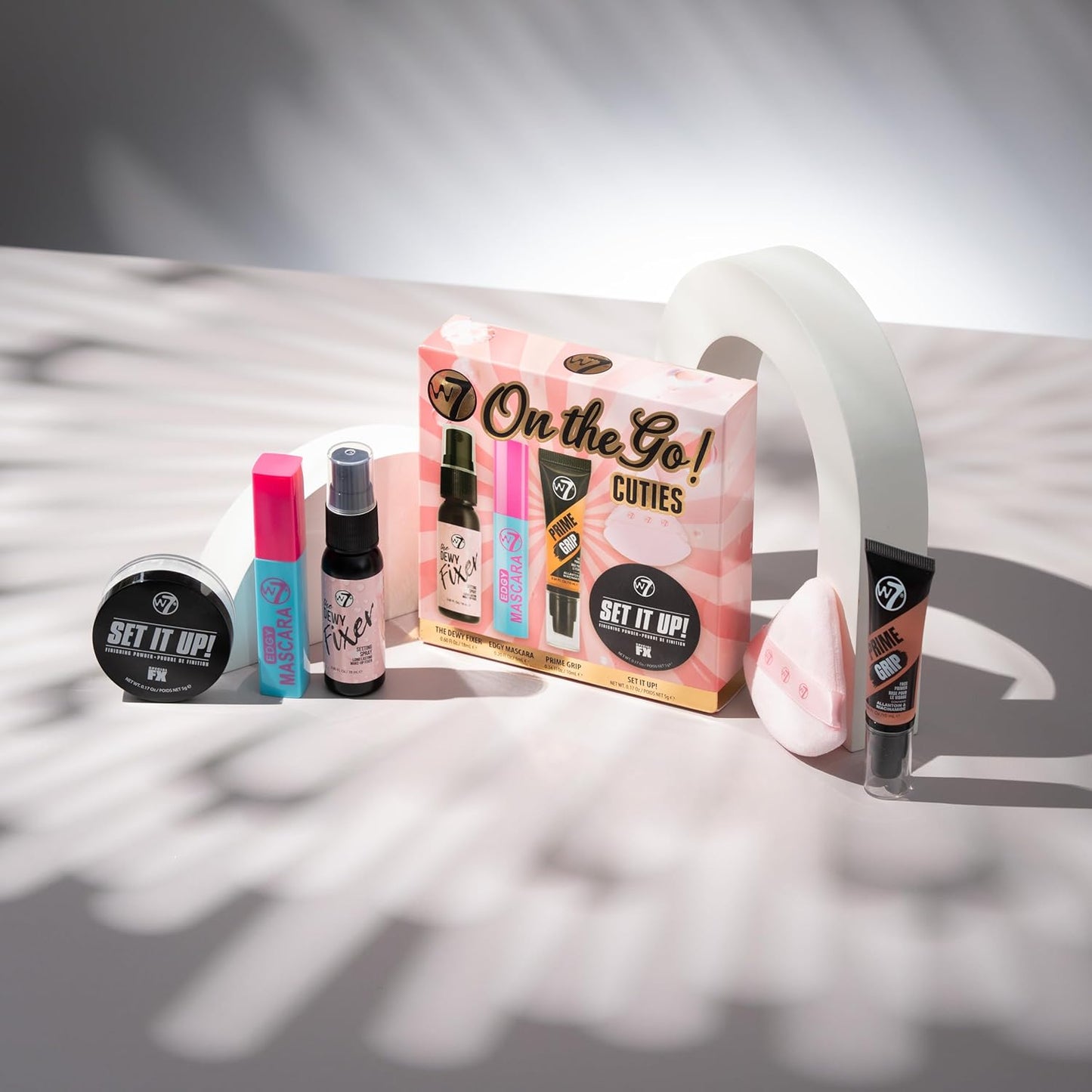W7 On the Go Cuties Gift Set - Mini Makeup Essentials with Primer, Mascara, Setting Spray, Loose Powder & Powder Puff - Travel Size Beauty Favourites - Stocking Stuffer